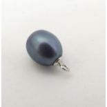 A pearl pendant / charm.