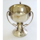 A hallmarked silver pedestal trophy cup .