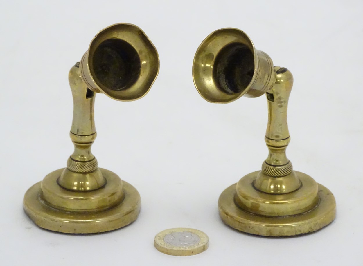 An unusual pair of brass candlesticks, having adjustable/angled sconces, marked 'The New London T.R. - Image 9 of 16