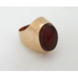 A yellow metal ring set with carnelian hardstone CONDITION: Please Note - we do