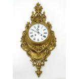 Cartel Clock : A Neo - Classical Louis XVI Style cast brass Cartel clock .