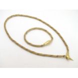 An 18ct gold necklace formed as a snake, the clasp formed as the snakes head.