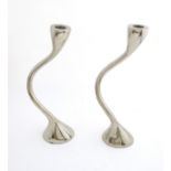 A pair of free form silver plate candlesticks in the style of Georg Jensen Cobra candlesticks.