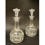 A pair of 19thC shaft and globe decanters and stoppers.