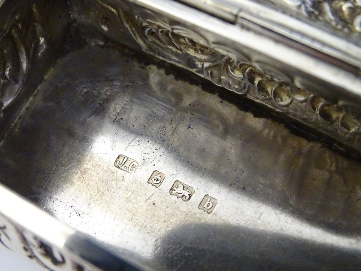 A silver dressing table box with hinge lid and embossed decoration. - Image 2 of 6