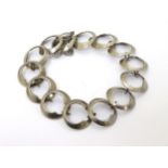 A Retro silver bracelet of circular links, hallmarked Birmingham 1974 .