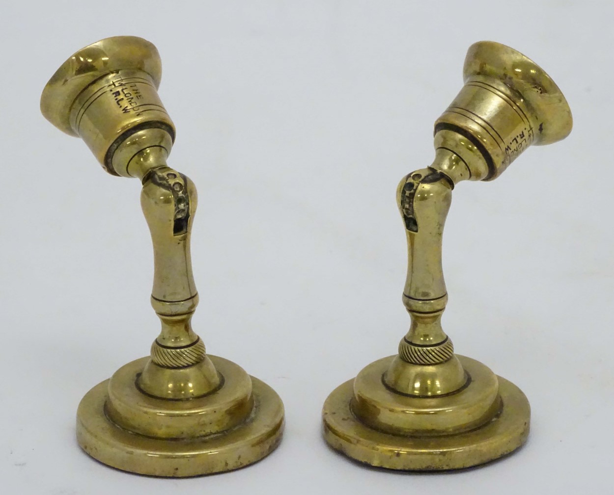 An unusual pair of brass candlesticks, having adjustable/angled sconces, marked 'The New London T.R. - Image 12 of 16