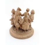 A c.1900 terracotta sculpture of French figures dancing in a circle.