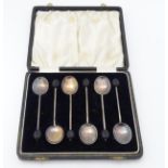 A cased set of 6 silver coffee spoons having coffee bean finial to handles hallmarked Birmingham