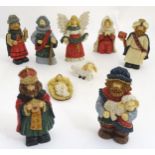 Christmas Decorations: A late 20th C set of painted carved nativity figures including baby Jesus,