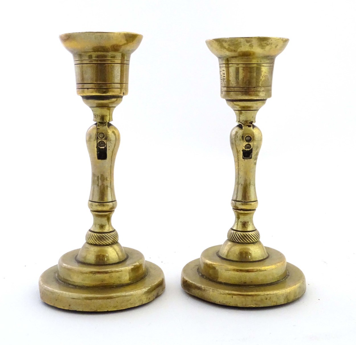 An unusual pair of brass candlesticks, having adjustable/angled sconces, marked 'The New London T.R. - Image 5 of 16