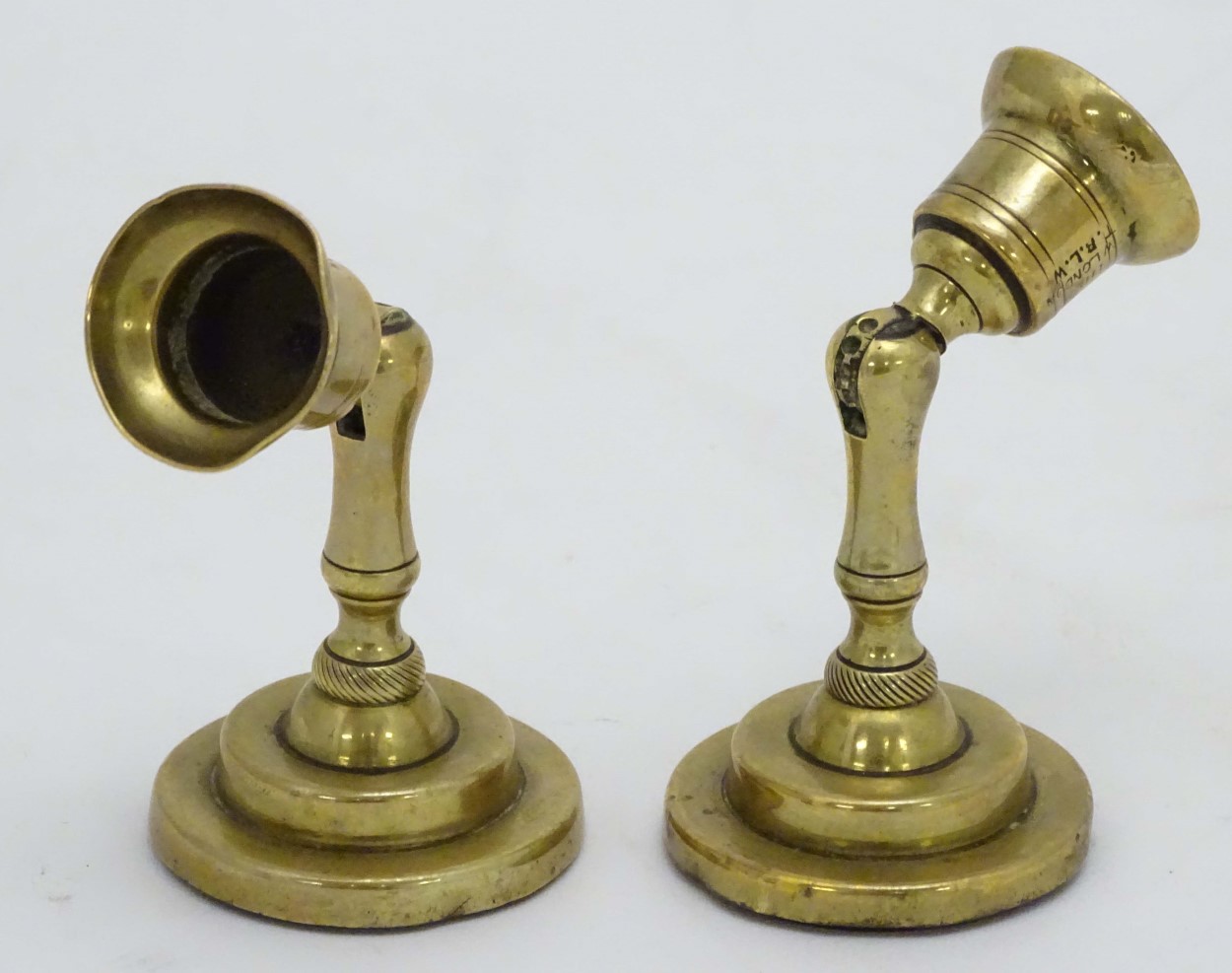 An unusual pair of brass candlesticks, having adjustable/angled sconces, marked 'The New London T.R. - Image 11 of 16