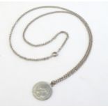 A necklace with 1861 Queen Victoria farthing pendant.