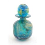 A Mdina glass scent bottle and stopper. Signed under.