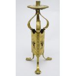 Arts and Crafts : a brass thee footed and cornered candle stand with integral snuffer still hanging