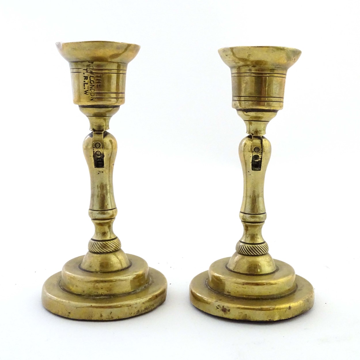 An unusual pair of brass candlesticks, having adjustable/angled sconces, marked 'The New London T.R. - Image 7 of 16