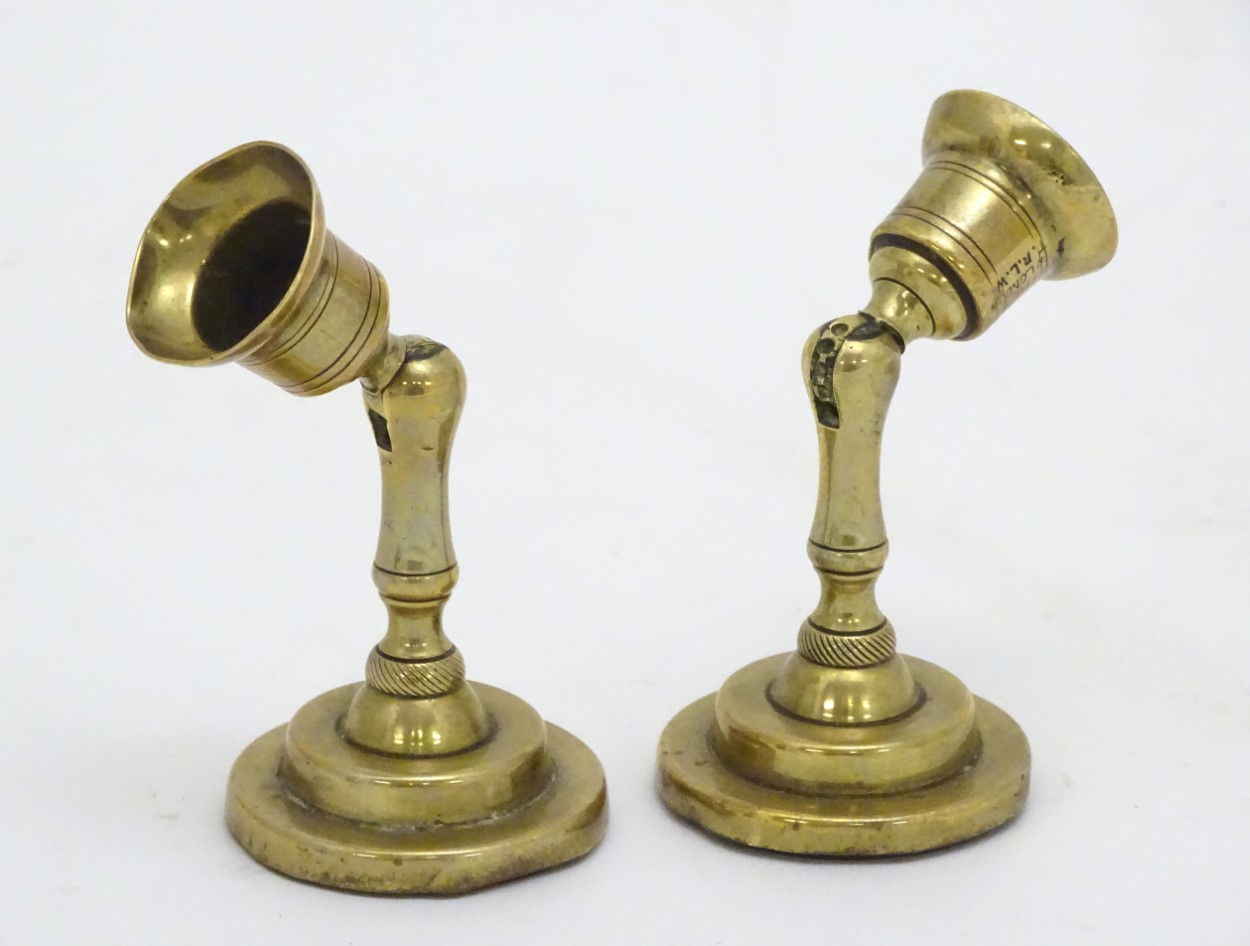 An unusual pair of brass candlesticks, having adjustable/angled sconces, marked 'The New London T.R. - Image 2 of 16