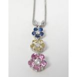 An 18ct white gold necklace set with pink,