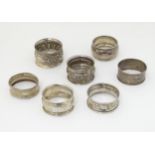 7 assorted silver napkin rings.