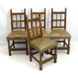 A set of four early / mid 20thC oak dining chairs with arcaded style carving to the top rail,