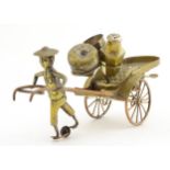 A 19thC silver plated brass oriental rickshaw formed novelty cruet stand containing lidded basket,