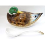 A serving soup bowl/ tureen with ladle in the form of a duck, 17" wide,