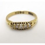 An 18ct gold ring set with 5 graduated diamonds CONDITION: Please Note - we do not