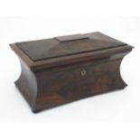 An early to mid 19thC Rosewood concave sarcophagus tea caddy with 2 sections and provision for