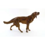 A 21stC cold painted bronze model of a red setter dog.