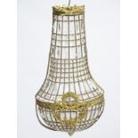 A 20thC Continental Regency style glass luster wall shade of basket shape.