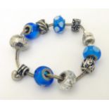 A Rhona Sutton silver bracelet with 9 assorted beads CONDITION: Please Note - we do