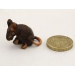 A 21stC cold painted bronze figure of a mouse.