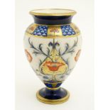 An Art Nouveau James MacIntyre style vase decorated in Imari colours with stylised flowers and gilt