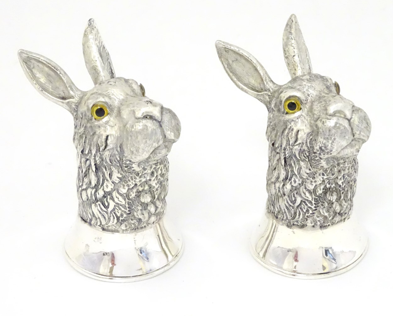 A pair of novelty white metal pepperettes formed as rabbit / hare heads 2 1/2" high