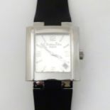 Christian Dior: a squared cased champagne silvered dial Swiss-made quartz wristwatch with date