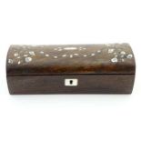 A small hardwood box with domed lid having inlaid mother of pearl detail.