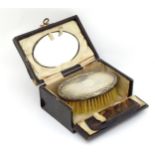 A travelling set comprising comb, brush and mirror,