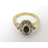 A 9ct gold ring set with blue stone and diamonds CONDITION: Please Note - we do not