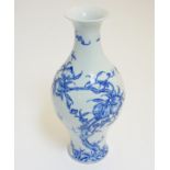 A Chinese blue and white 'Bat and Fruit' vase,