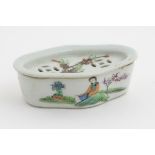 A Chinese lozenge lidded dish hand painted with 4 character markings and a figure in a landscape to