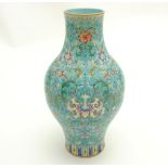 A Chinese Famille Rose turquoise-ground cloisonné-imitation vase, with round bulbous body to centre,