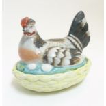 A 19thC Staffordshire hen on nest tureen with yellow basket,