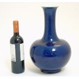 A Chinese blue monochrome Shangping vase with globular body and flared rim,