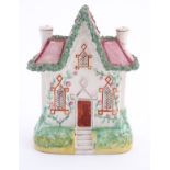 A Staffordshire pottery flat back house. Approx. 8 ½” high x 6” wide.