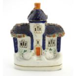 A Staffordshire pottery flat back house. Approx. 6 1/2” tall x 4 1/2” wide.