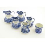 Four blue and white graduated octagonal baluster jugs by Copeland,