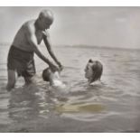 *Capa (Robert, 1913-1954). Pablo Picasso and Francoise teaching their baby Claude to swim, c.