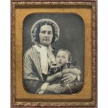 *Ninth-plate daguerreotype of a mother and child, by Tyler & Co., Corner of Washington and Winter