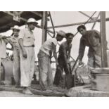 *Freund (Gisela, 1908-2000). Oil workers in Mexico, c. 1950, printed later, gelatin silver print,