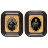 *Pair of half-plate ambrotypes of husband and wife, early 1860s, 15 x 11cm, gilt oval mats, wooden